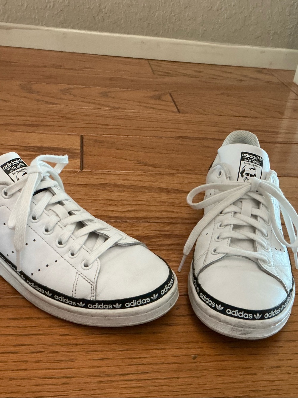 adidas women’s White and Black Stan Smith Sneakers